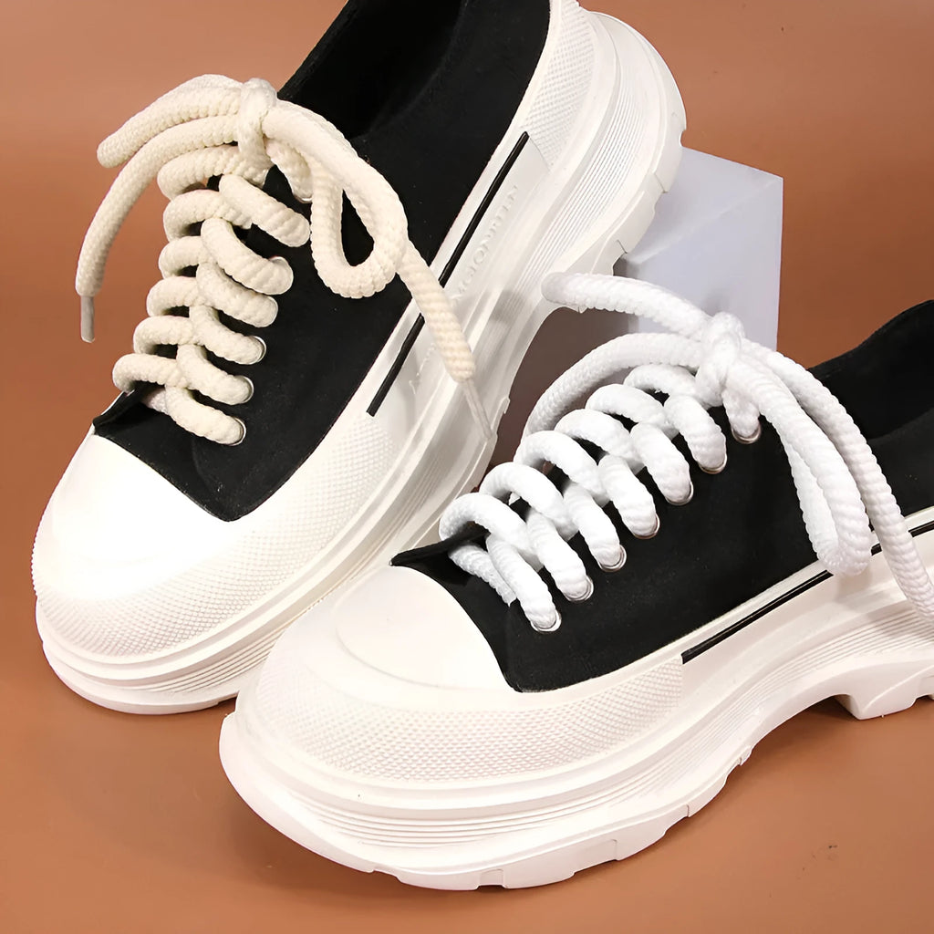 Pair of round woven shoelaces in white next to a ruler showing 10mm diameter and length scale.