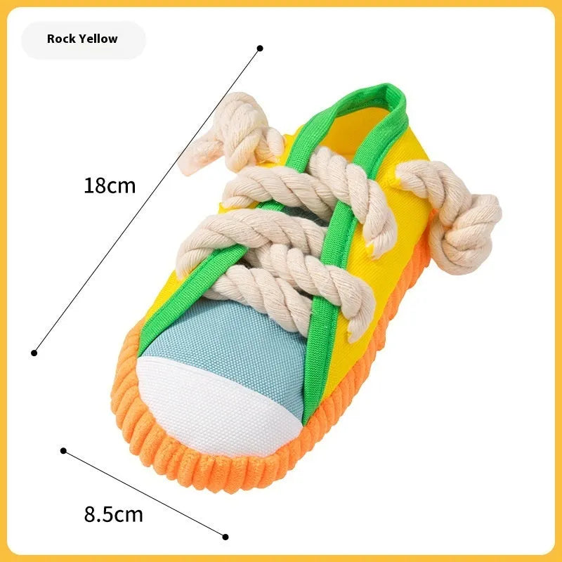 Plastic slipper-shaped dog chew toy in yellow colour for teething relief