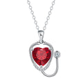 Red diamond coloured women's necklace with wings, cross, and stethoscope pendant.