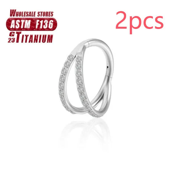 Close-up of a titanium alloy fork nose ring in silver, showing the two-prong design on a grey background.