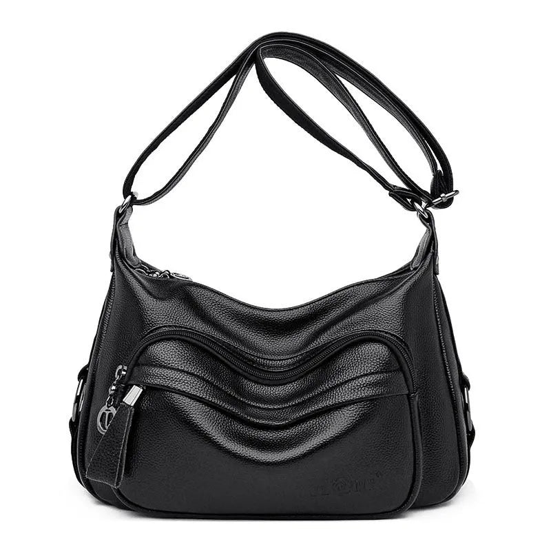 Large black PU shoulder bag with crossbody strap showing multiple internal compartments and zipper closure