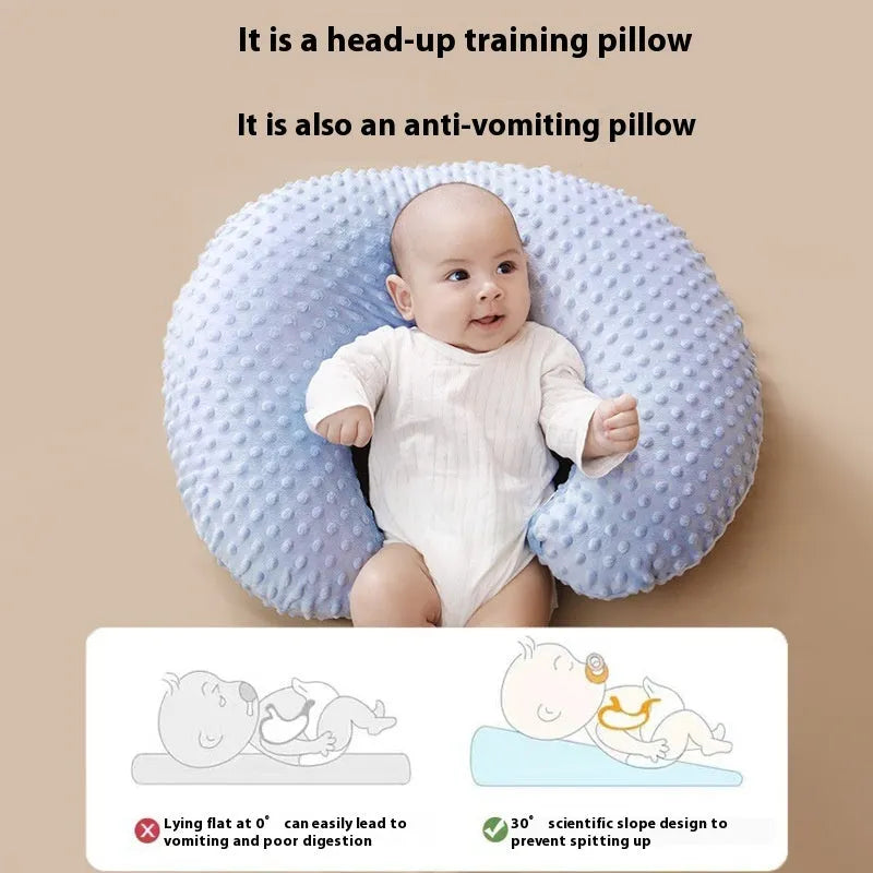 Multifunctional nursing pillow with a removable cover in grey, designed for feeding support and spill prevention.