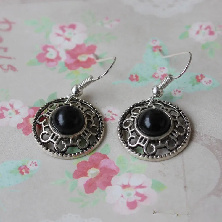Miao ethnic silver and turquoise earrings with geometric flower disk design and auspicious patterns