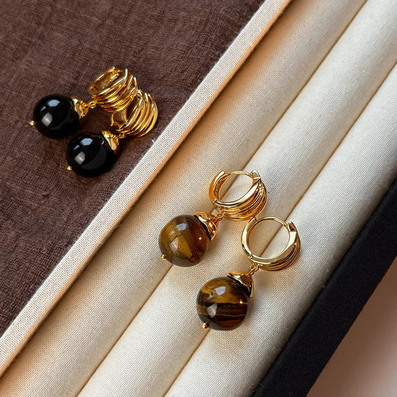 Gold-plated geometric earrings made from brown and black Tigereye stone in a French retro style.