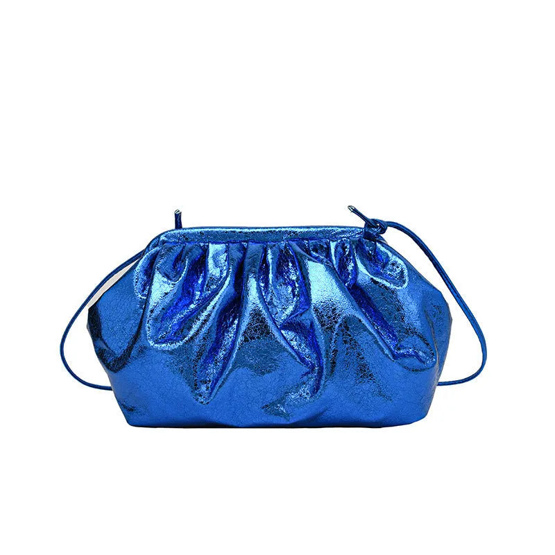 Simple hair clip fastening crossbody bag in shell shape, shown in rose red colour.