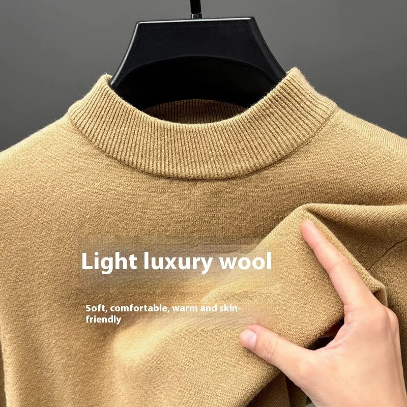 Man wearing a solid colour half turtleneck long sleeve jumper in a casual setting.