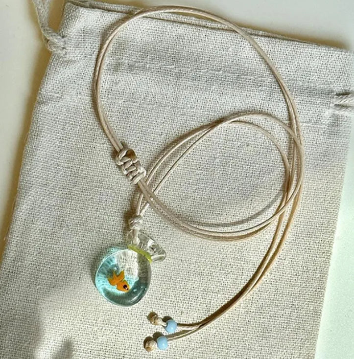 Women's coloured glaze pendant necklace with cotton linen chain featuring Skirt Everyday Joker design
