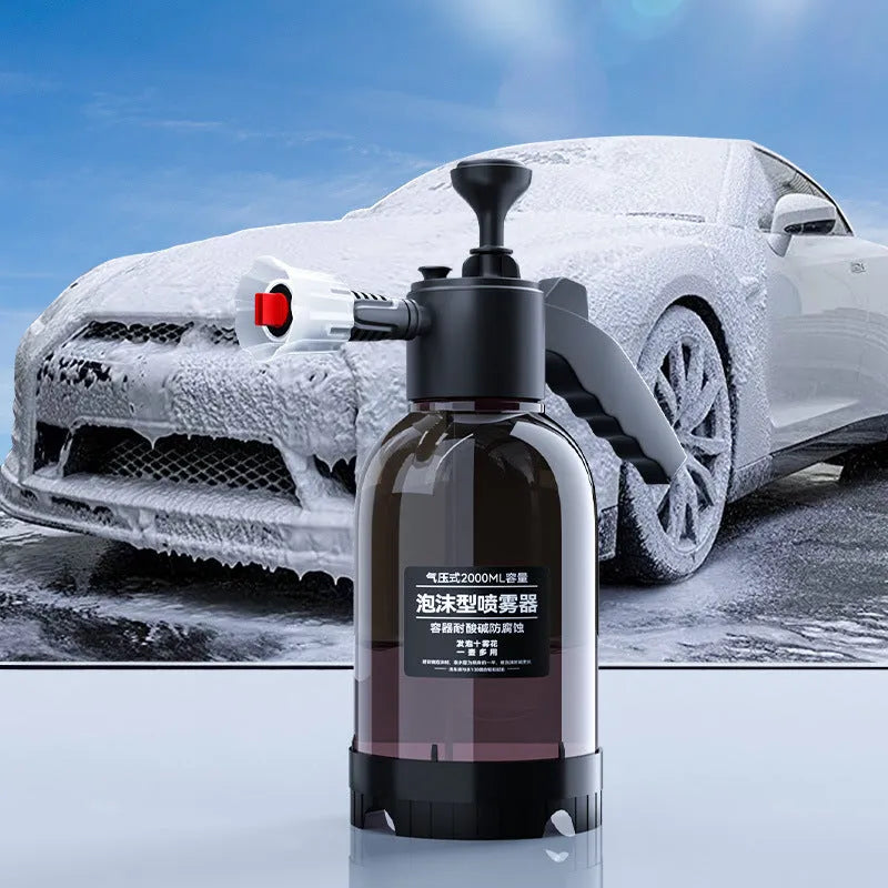 Black hand-held sprayer bottle with ergonomic handle and two nozzles for garden watering and car washing