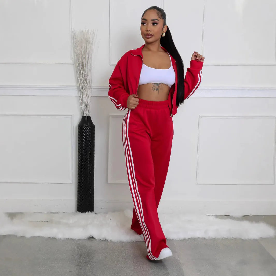 Grey striped streetwear two-piece set featuring a sweater with regular sleeves and matching trousers.