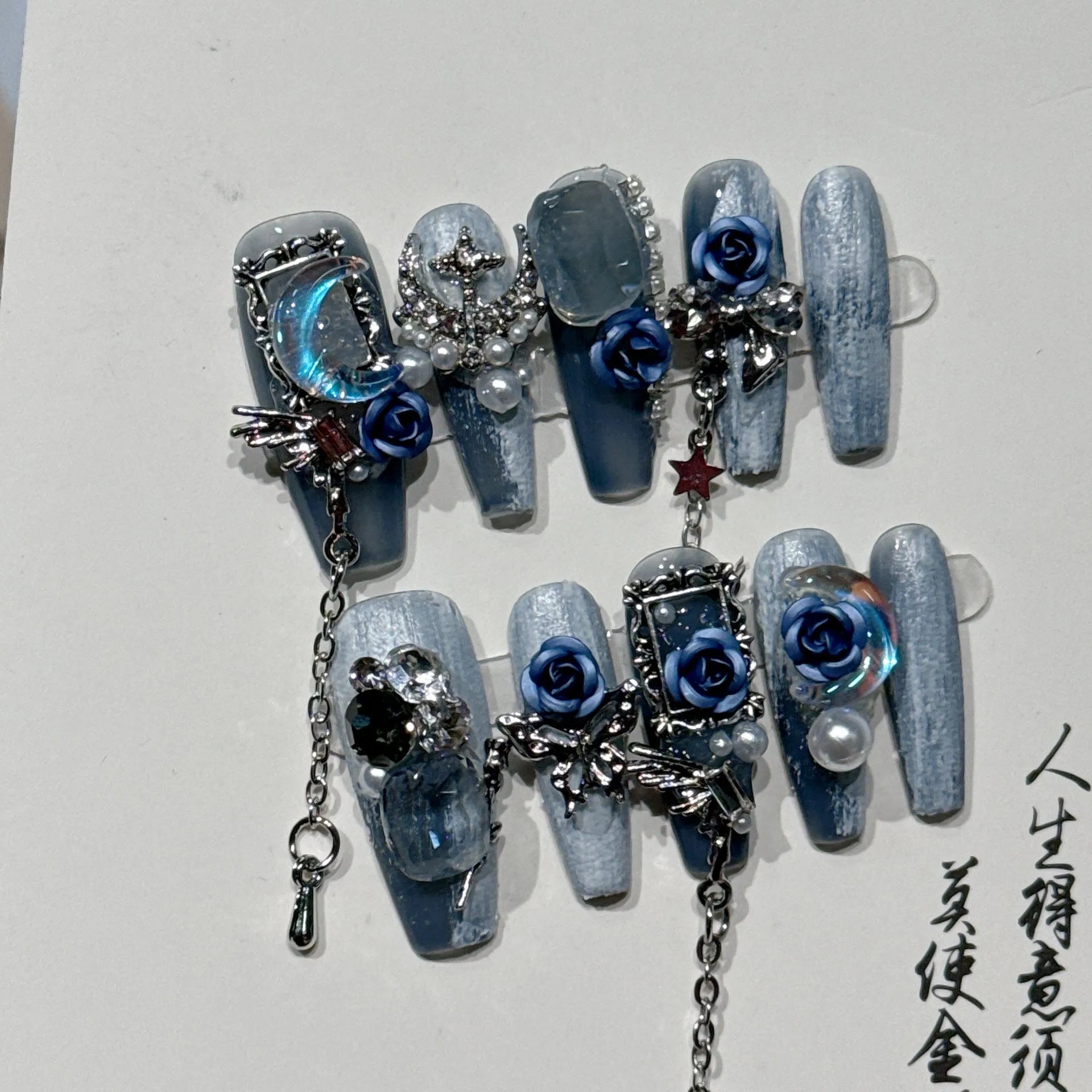 Blue manicure nails with rose tulip floral pattern in plastic armour construction