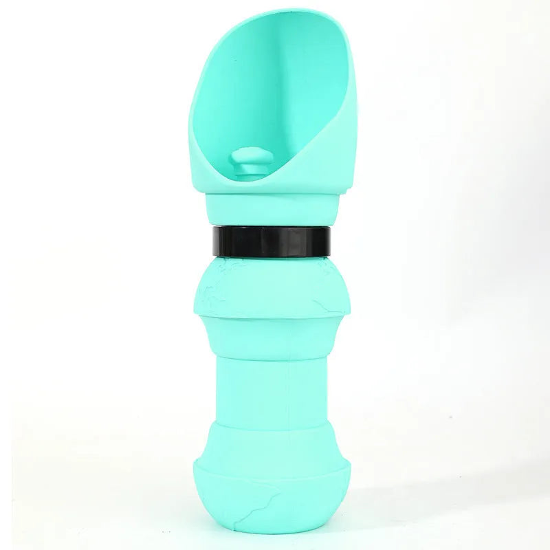 A folded and unfolded silicone water cup for pets, shown in green pineapple colour.