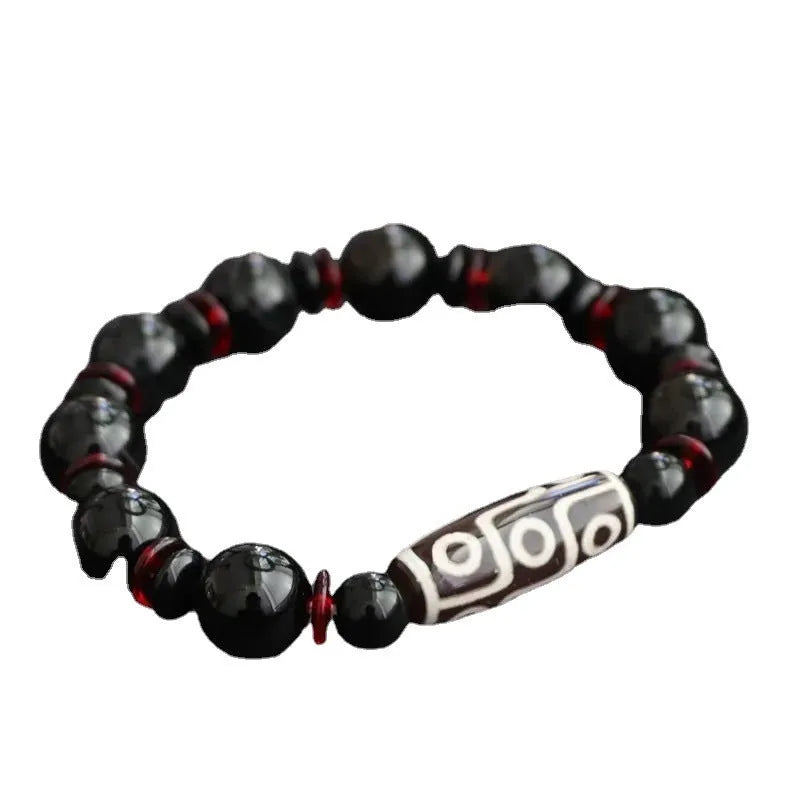 Black agate Dzi bead bracelet with geometric 11mm beads on wrist