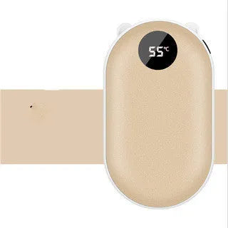Compact rose gold USB rechargeable hand warmer and power bank with digital display on a wooden table.