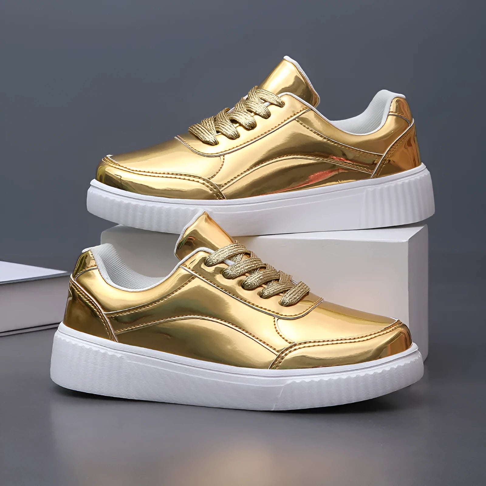 Rose gold sequinned platform sneakers with round toe and thick sole on a white background