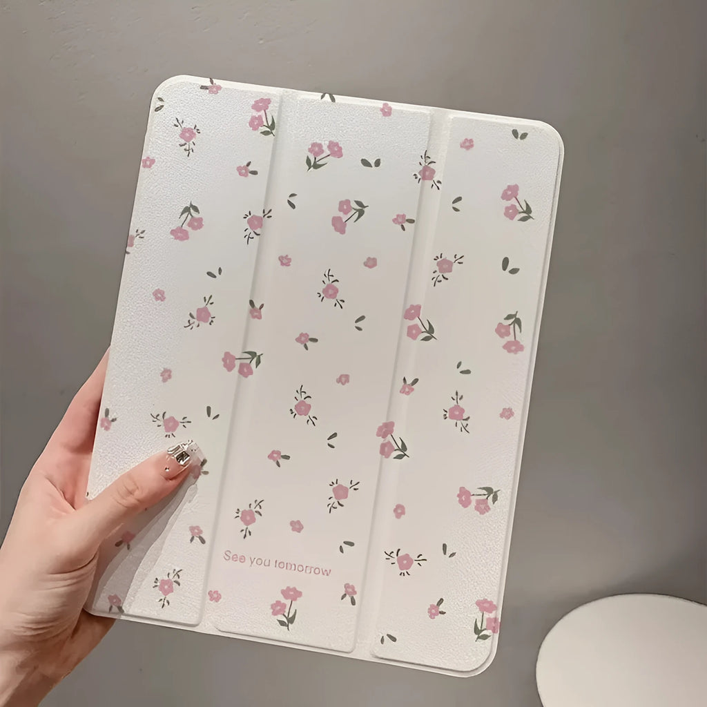 Clear tri-fold iPad case with floral design, shown in stand mode.