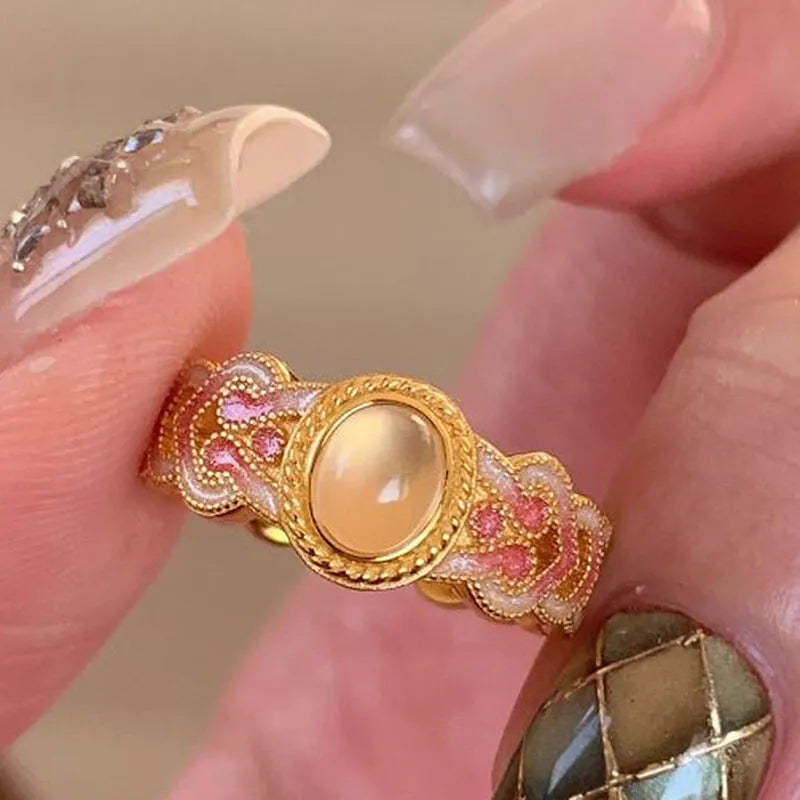 Pink crystal enamel open ring with geometric shape and gold plating on copper