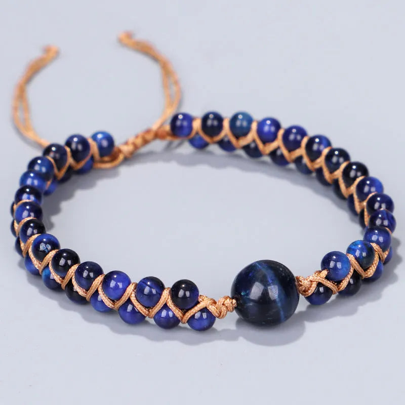 Handmade woven bracelet with geometric pattern in blue tigereye or amethyst stone beads