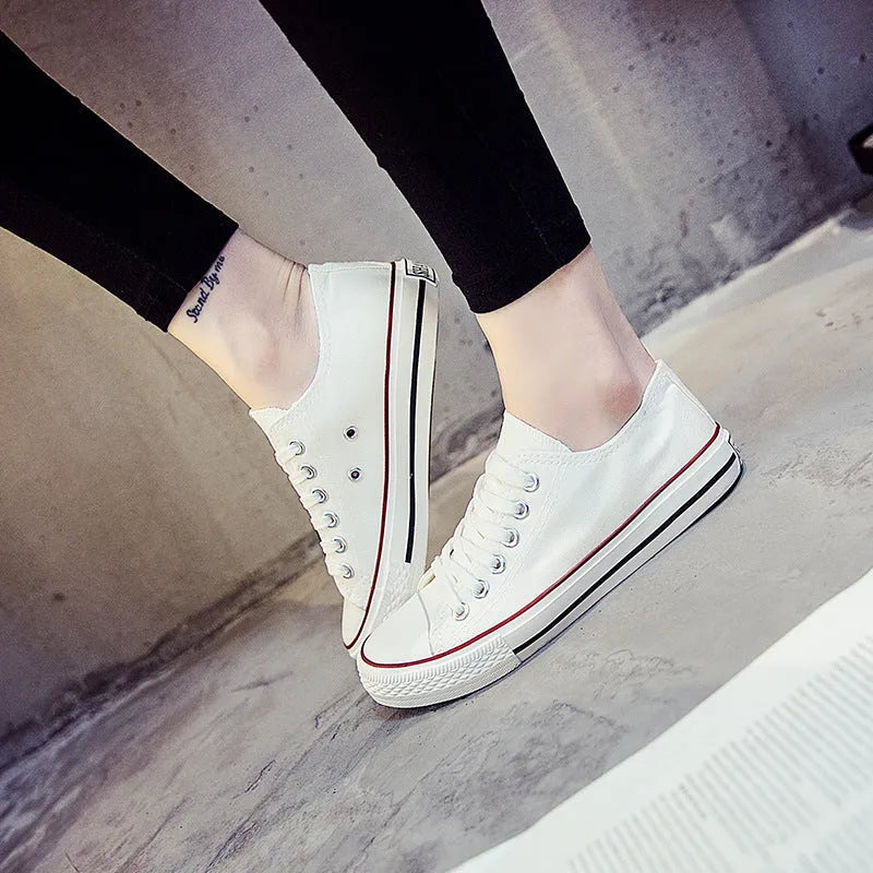 Solid colour women's casual canvas slip-on shoes on a white background, showing the simple design and canvas upper material.