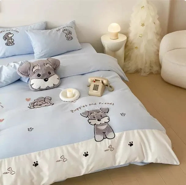Cartoon Schnauzer embroidered bedding set with quilt cover, sheet, and pillowcases on bed