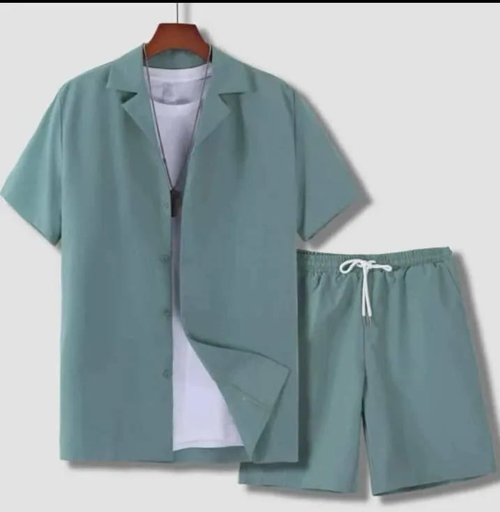 Man wearing a white short sleeve Cuban collar sport jacket with matching shorts.