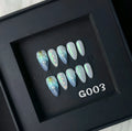 Blue plastic nail tip shells in four sizes for nail extensions and decorative manicures