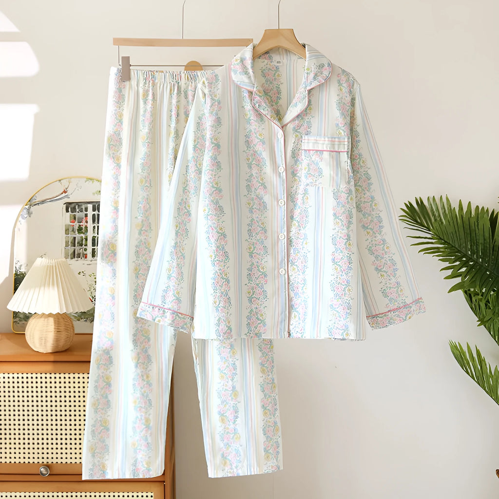 Ladies' red small fruit print cotton gauze long-sleeved top and matching trousers homewear set laid flat.