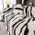 Zebra pattern flannel sofa cover with non-slip design on furniture