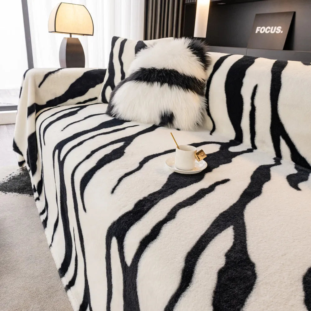 Zebra pattern flannel sofa cover with non-slip design on furniture