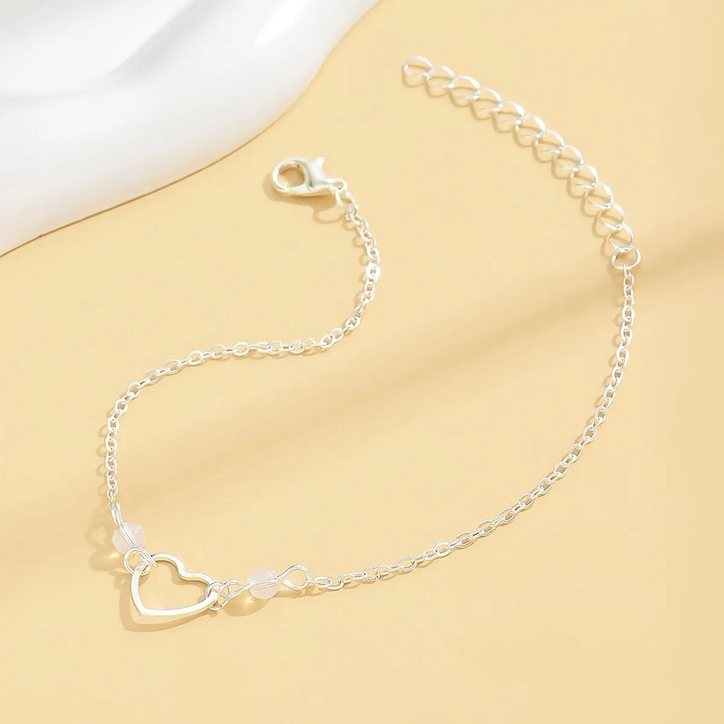 Women's adjustable ankle bracelet with geometric heart pendant in gold or silver alloy