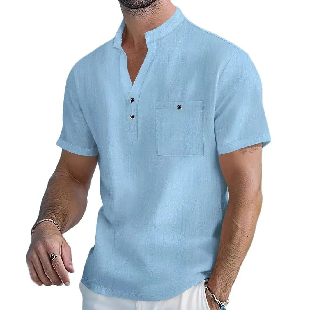 Man wearing a light-coloured linen stand collar short sleeve t-shirt in a relaxed fit.