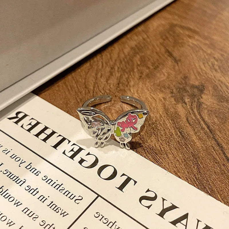 Women's copper butterfly ring with dripping oil finish and adjustable open loop design