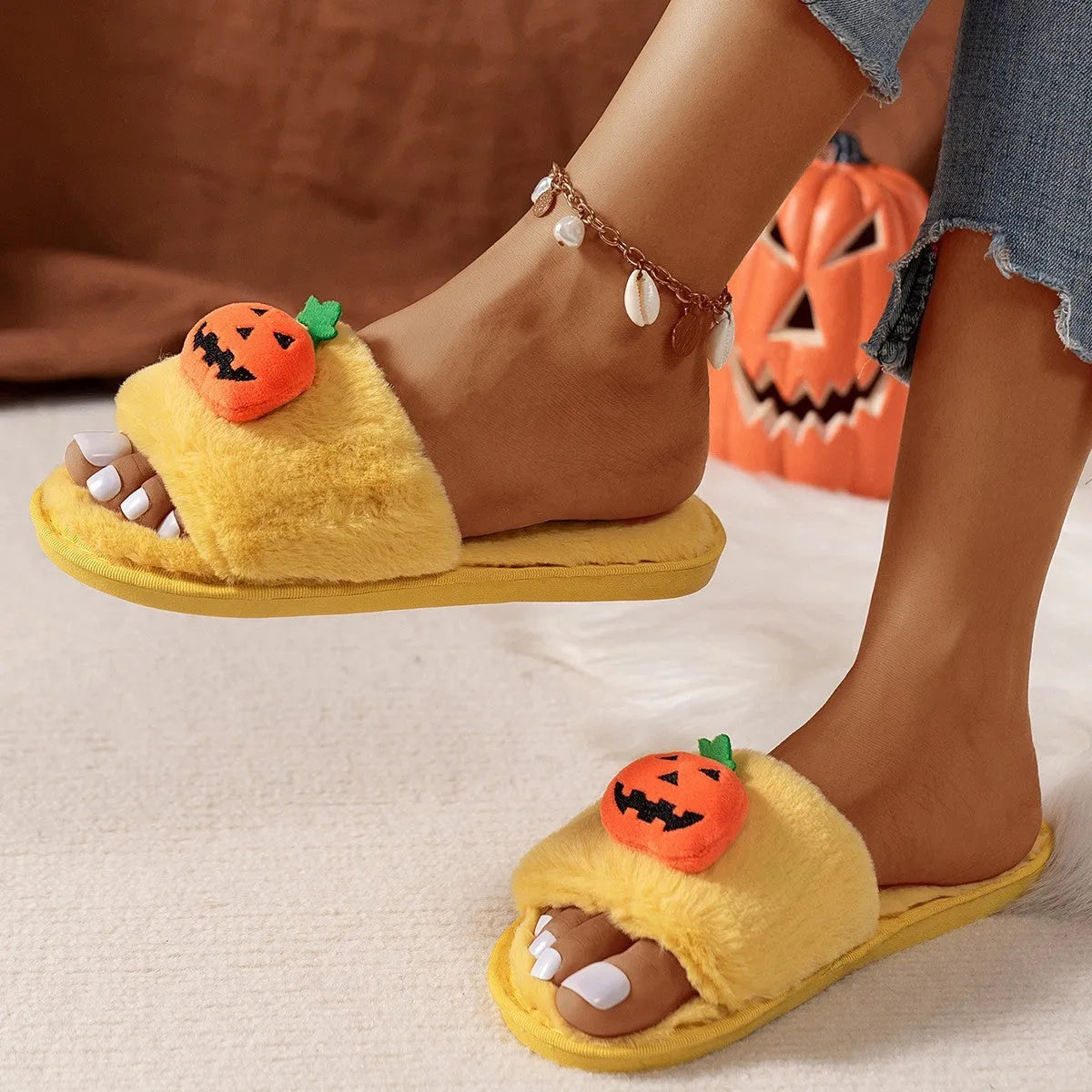 Pumpkin-themed plush slippers with synthetic fur upper and anti-slip PVC sole
