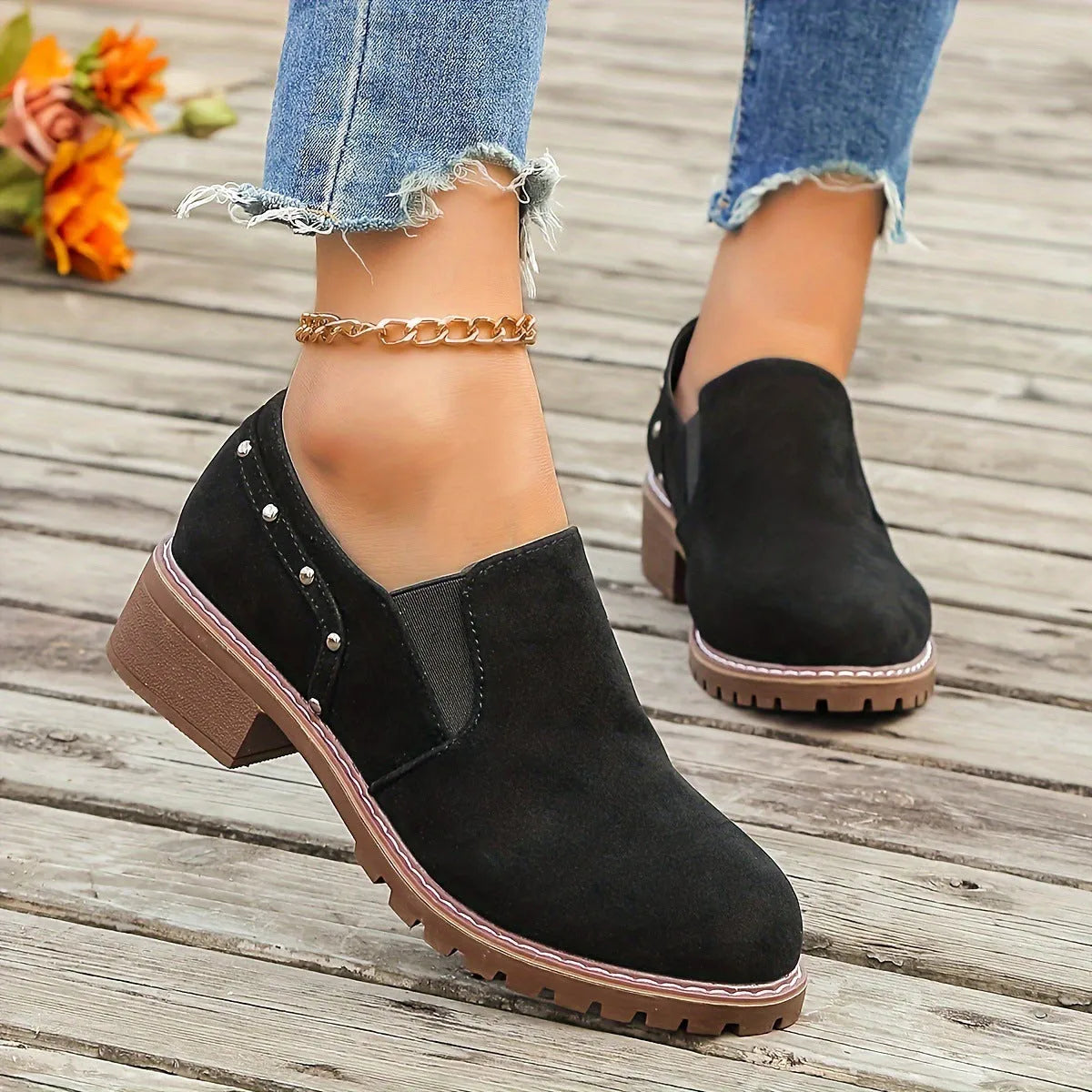 Women's light brown suede ankle boots with a thick low heel and elastic band fastening.