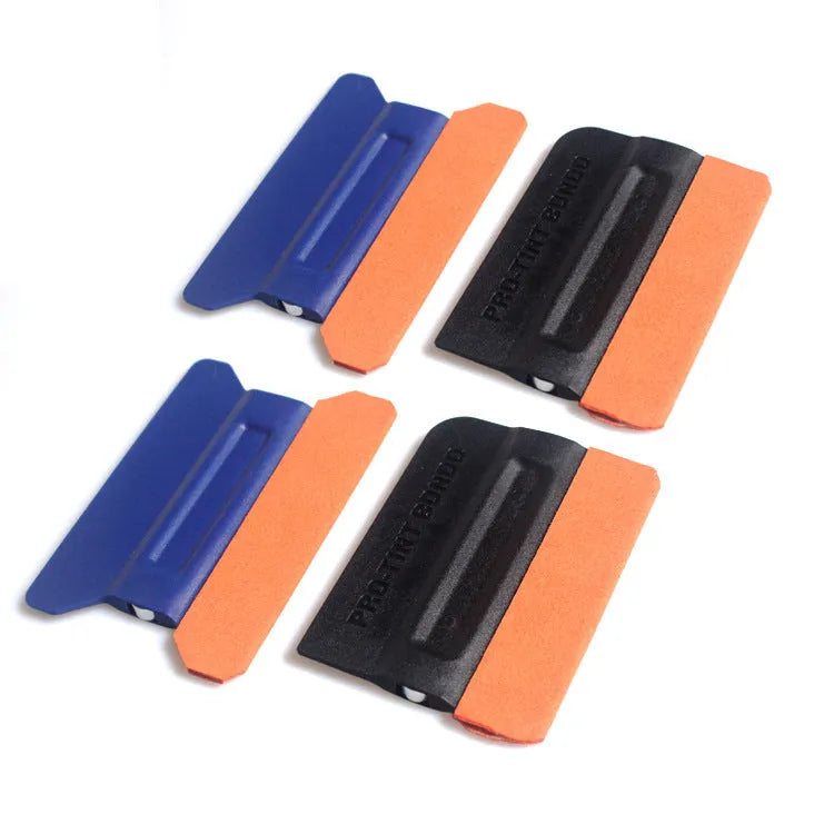 Car film scraper tool with ABS handle and four coloured scraping pads for vehicle wrap application.