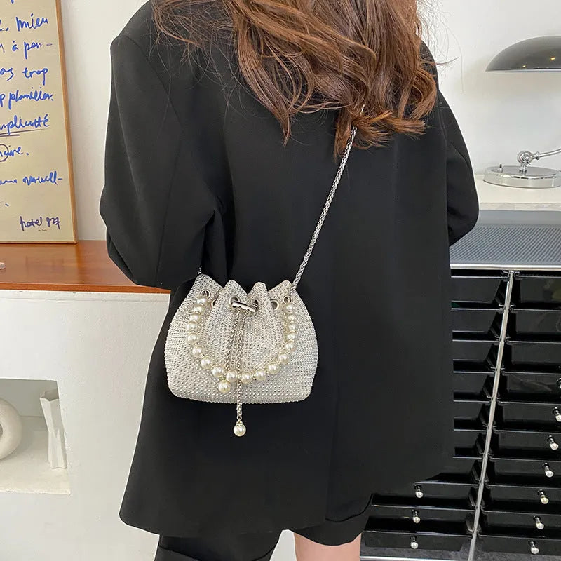 Black PU leather women's crossbody bag with diamond shoulder strap and chain detail