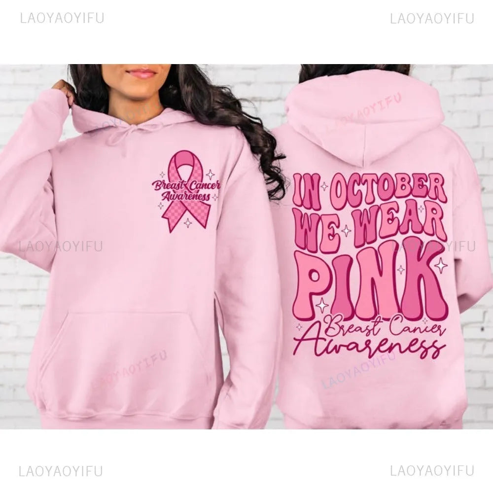 Breast Cancer Awareness pullover hoodie with retro art print and side seam pockets, shown in pink.