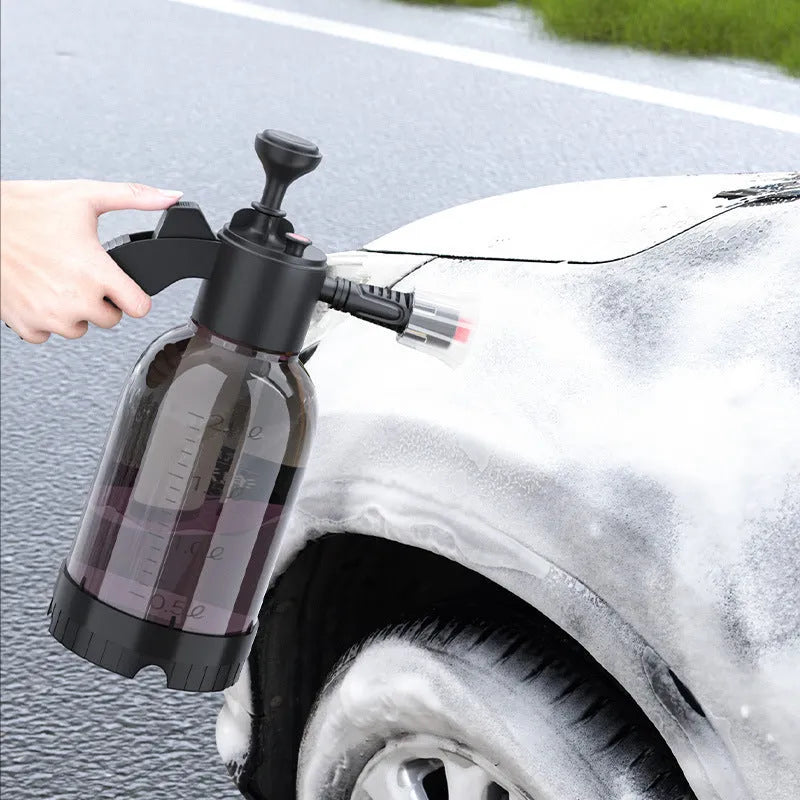 Black hand-held sprayer bottle with ergonomic handle and two nozzles for garden watering and car washing