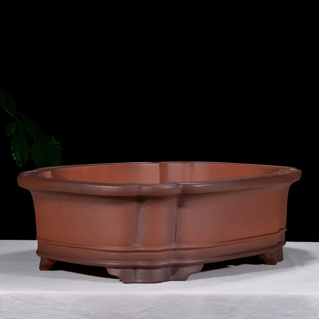 Large antique-finish Chinese purple clay flowerpot shaped like a tree stump with decorative carvings.