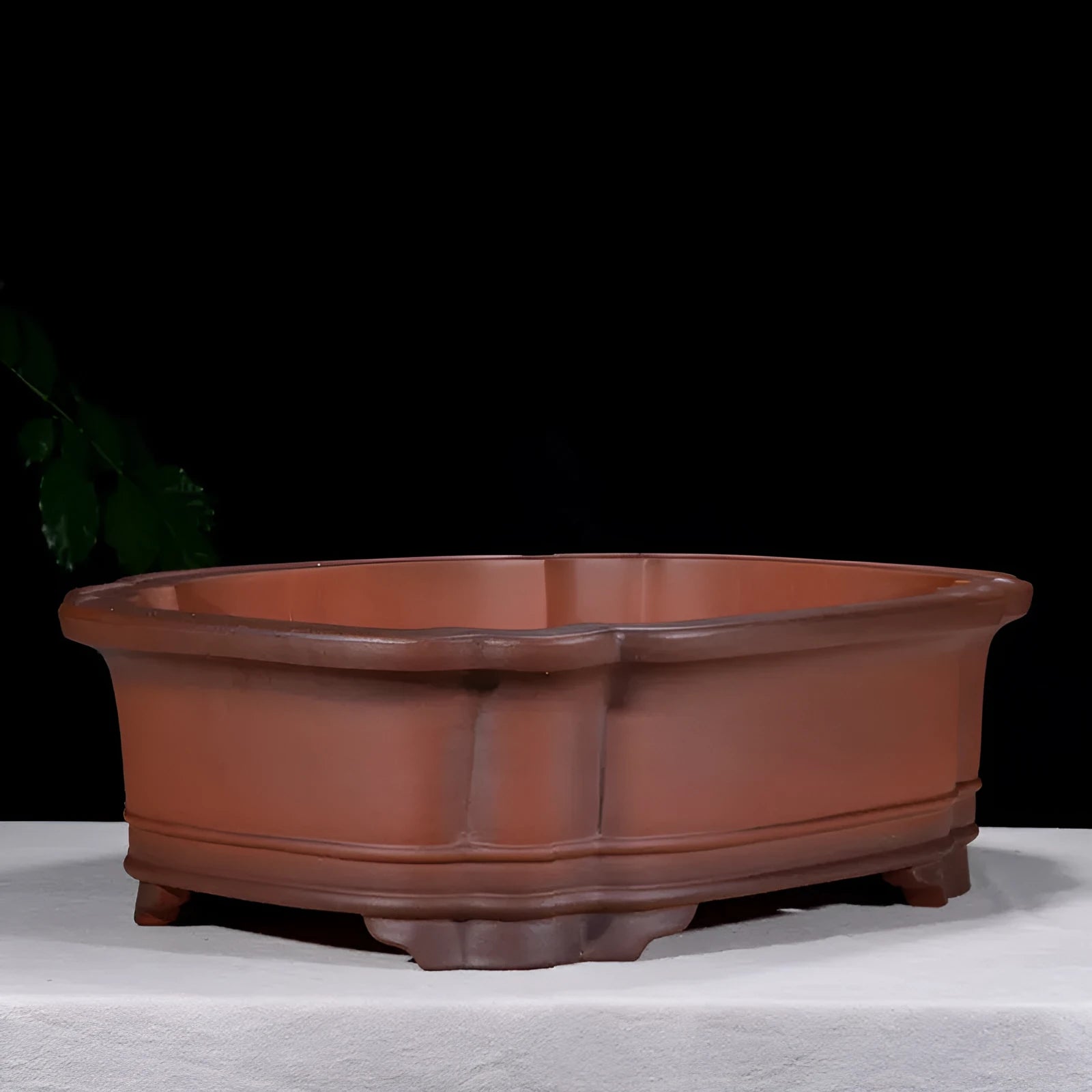 Large antique-finish Chinese purple clay flowerpot shaped like a tree stump with decorative carvings.