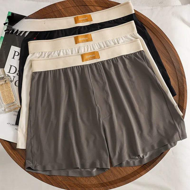 Pack of three pairs of men's solid colour ice silk underwear in loose fit.