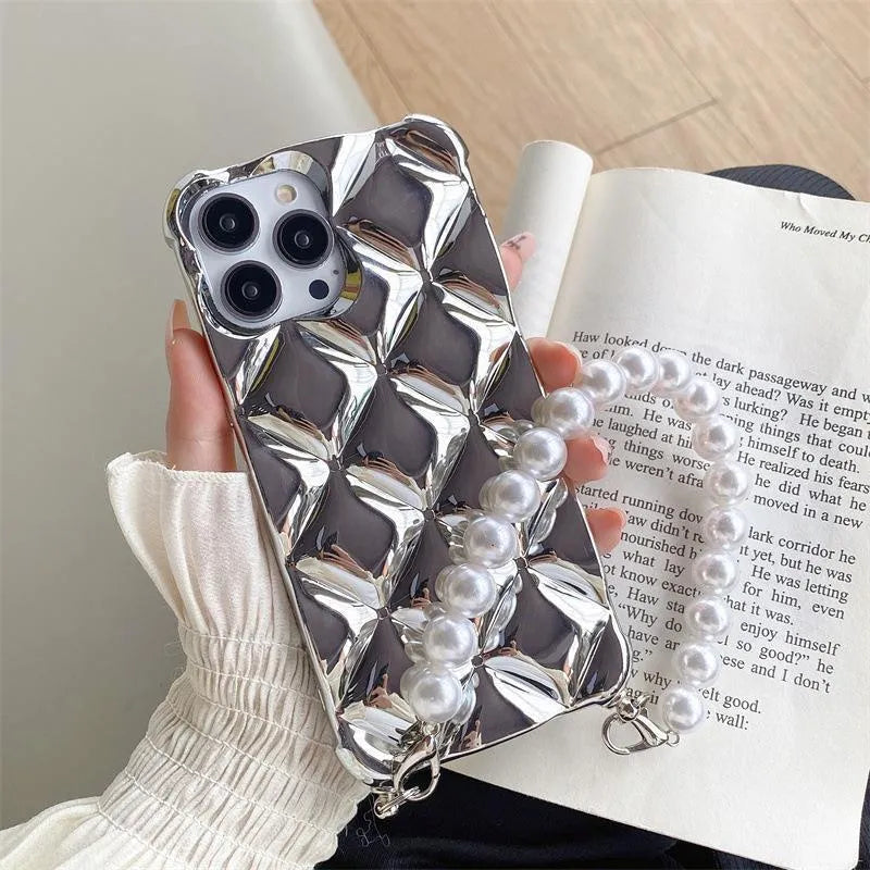 Silver and gold luxury diamond bracelet iPhone cases with chain strap and lock charm for various models.