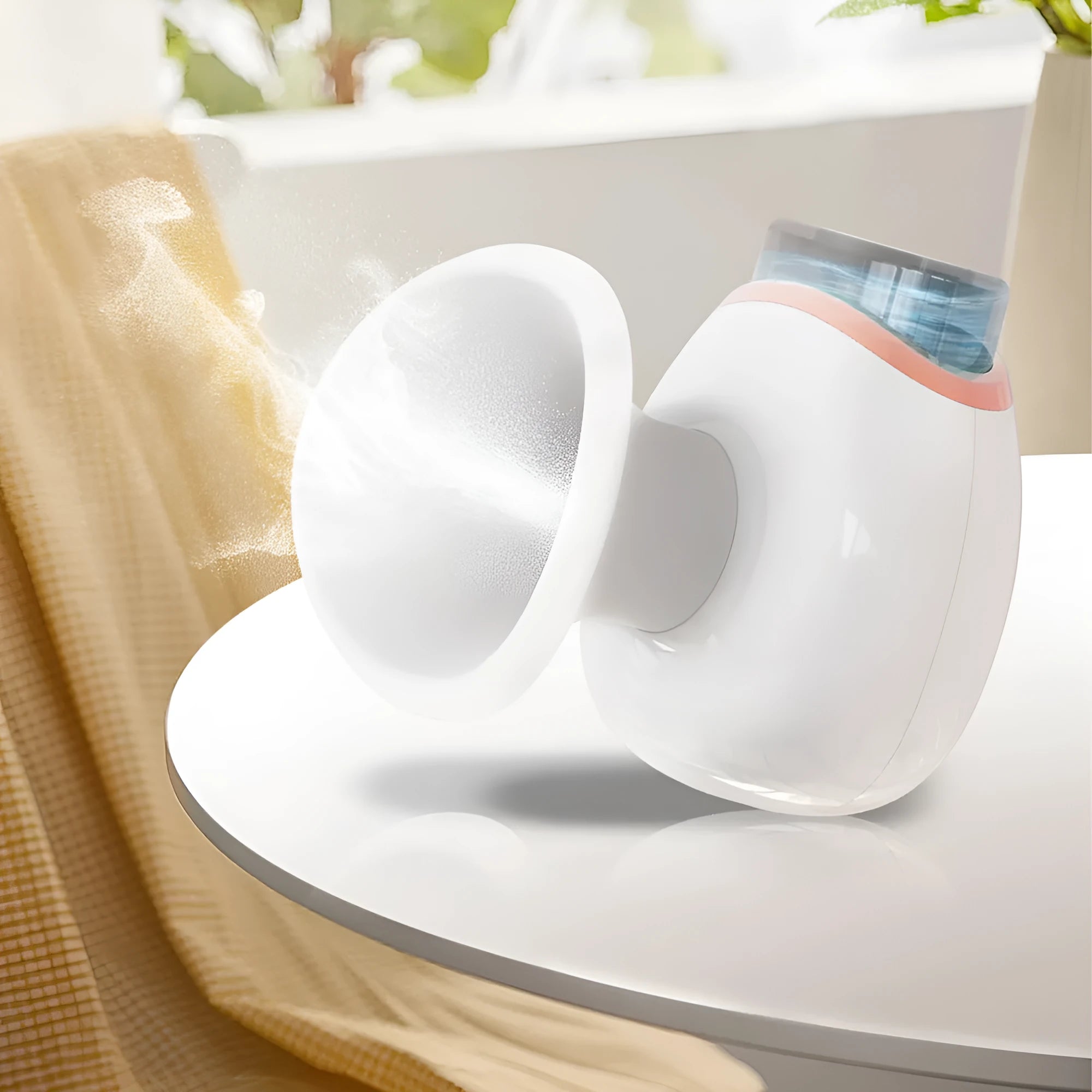 Purple and white household eye humidifier with charging cable on white background