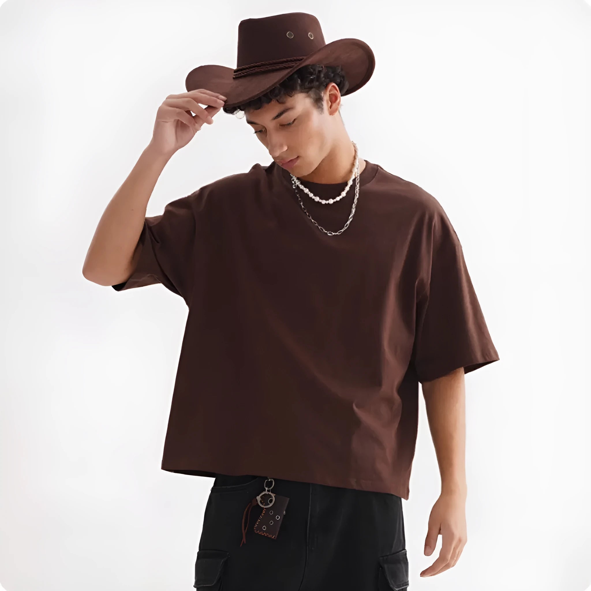 Men's loose fit pure cotton T-shirt in apricot colour on a hanger