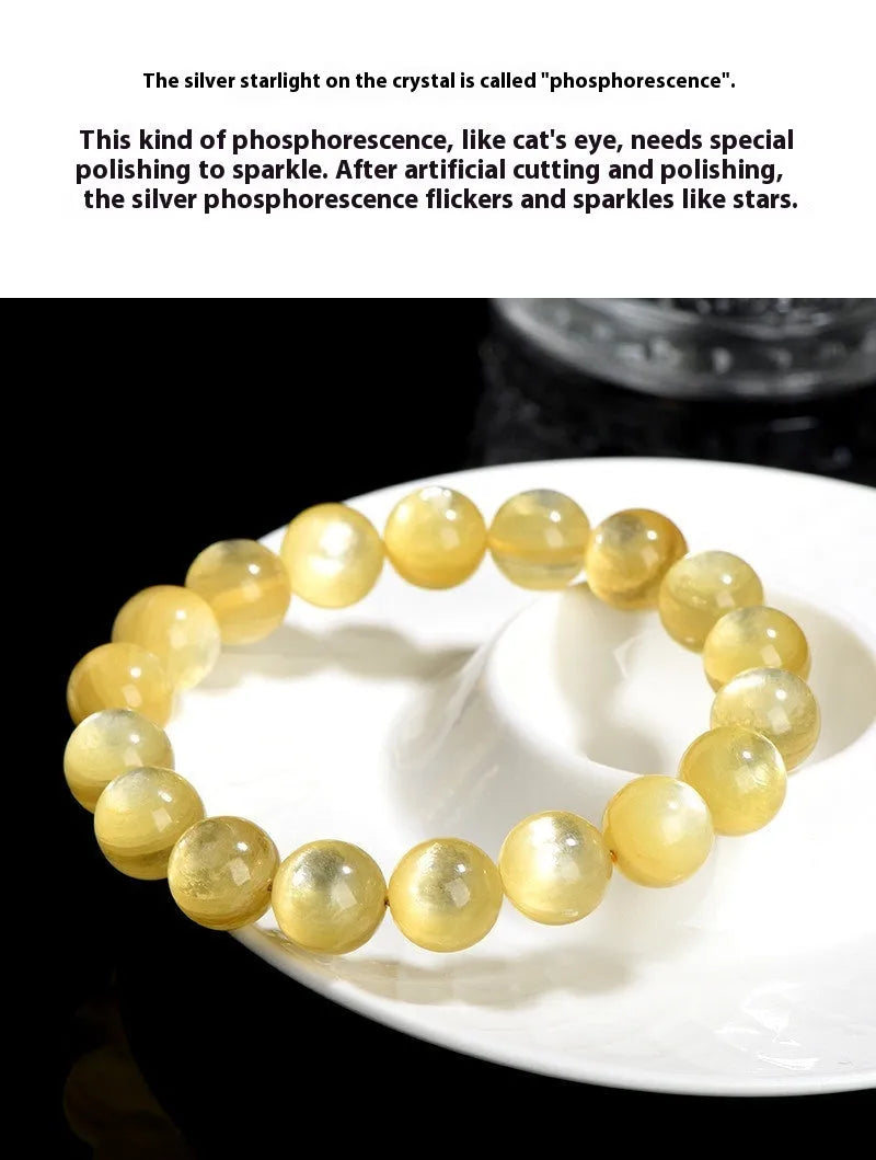 Yellow Lepidolite mica stone bead bracelet with round geometric design on wrist