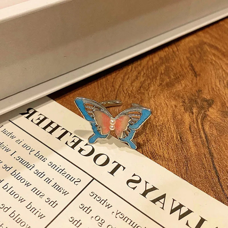 Women's copper butterfly ring with dripping oil finish and adjustable open loop design