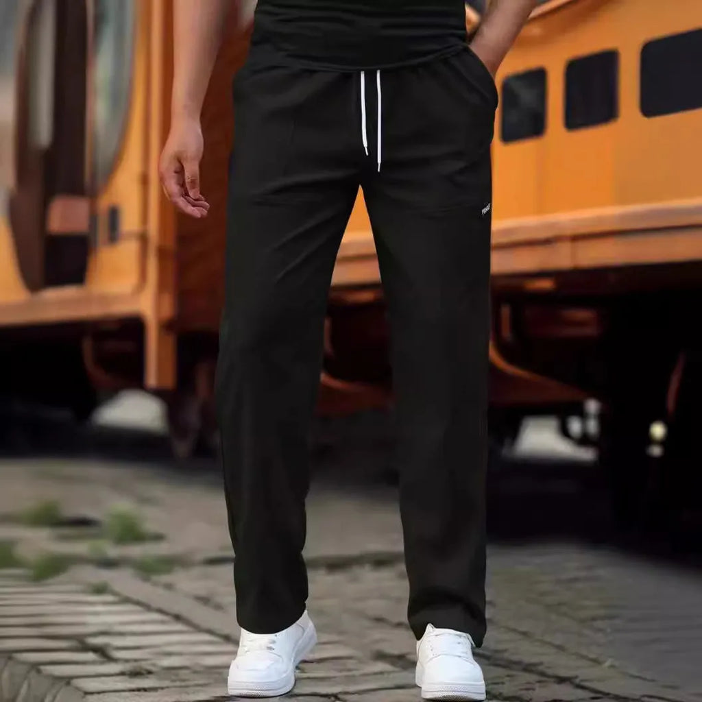 Men's lightweight polyester casual trousers in light grey colour shown flat