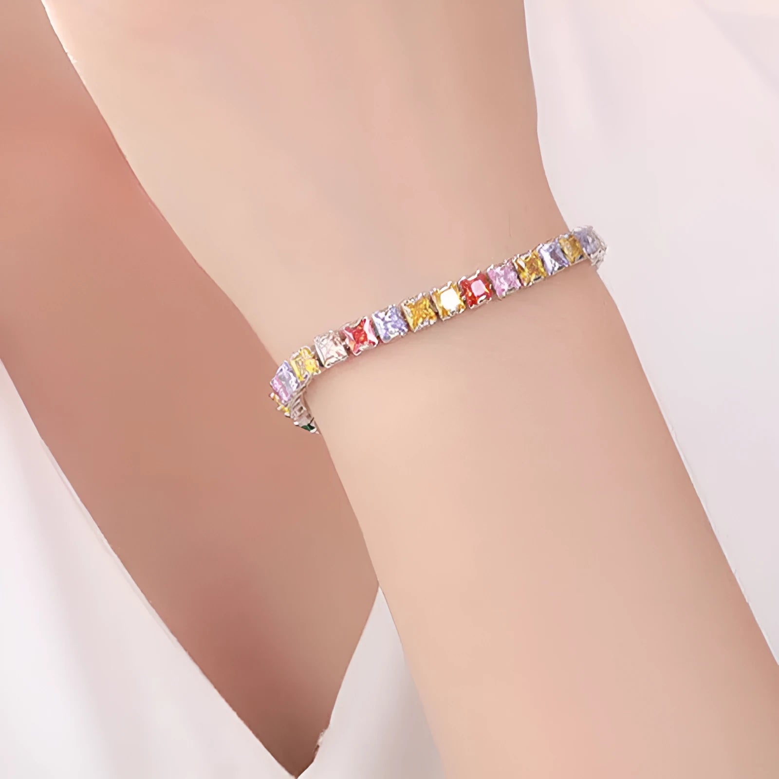Electroplated real platinum women's bracelet with square diamond geometric design and gang drill details.