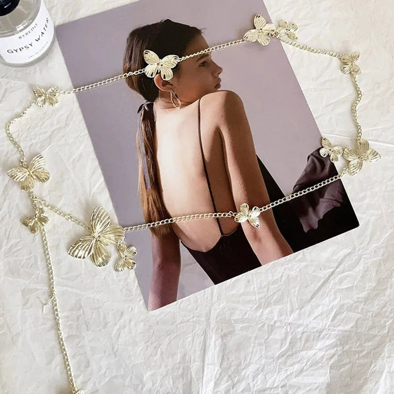 Gold and silver alloy waist chain with butterfly ornament, showing 104cm length.
