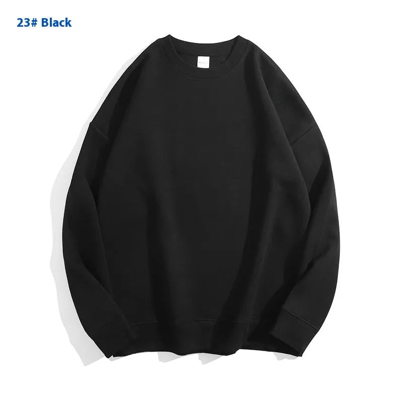 A loose round neck off shoulder pullover sweater in a solid colour, with long sleeves.