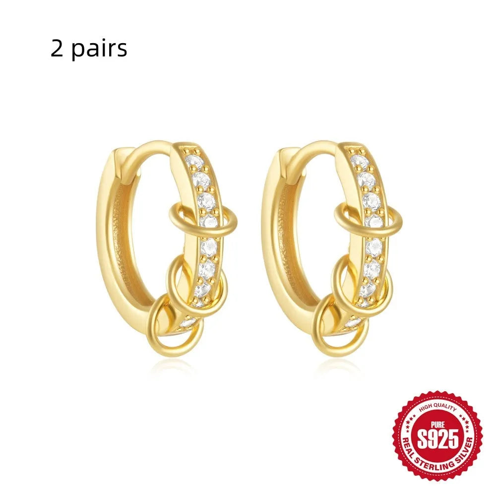 Sterling silver geometric stud earrings with small round designs in gold or silver electroplated finishes